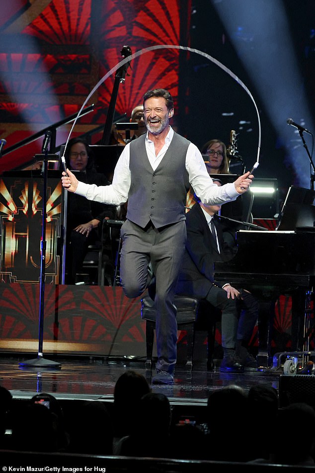 Known for his good-humour, a clearly amused Hugh smiled broadly as he skipped a rope in the middle of the performance