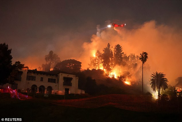 Twenty-eight people are known to have died across the Los Angeles area, however, officials have said the true death toll is not known as the fires continue to destroy neighborhoods. Pictured: Flames rise from the Sunset Fire in the hills overlooking the Hollywood neighborhood of Los Angeles