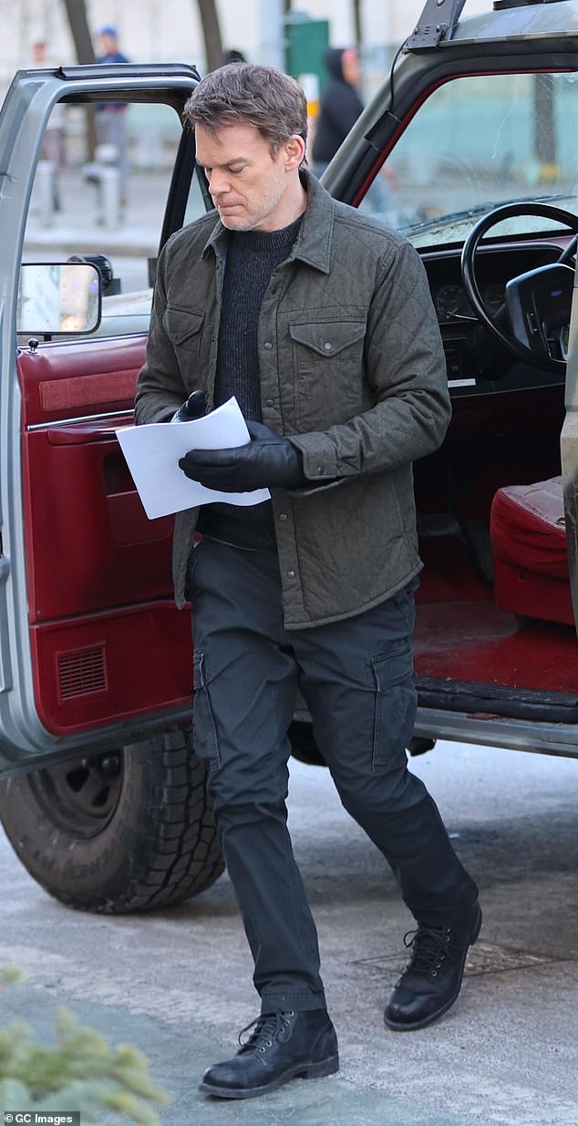 Hall added a pair of dark pants with cargo pockets, black lace-up work boots, and black leather gloves