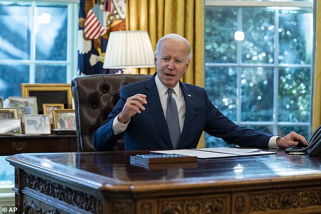 President Joe Biden speaks before signing an executive order to improve government services, in the Oval Office of the White House,