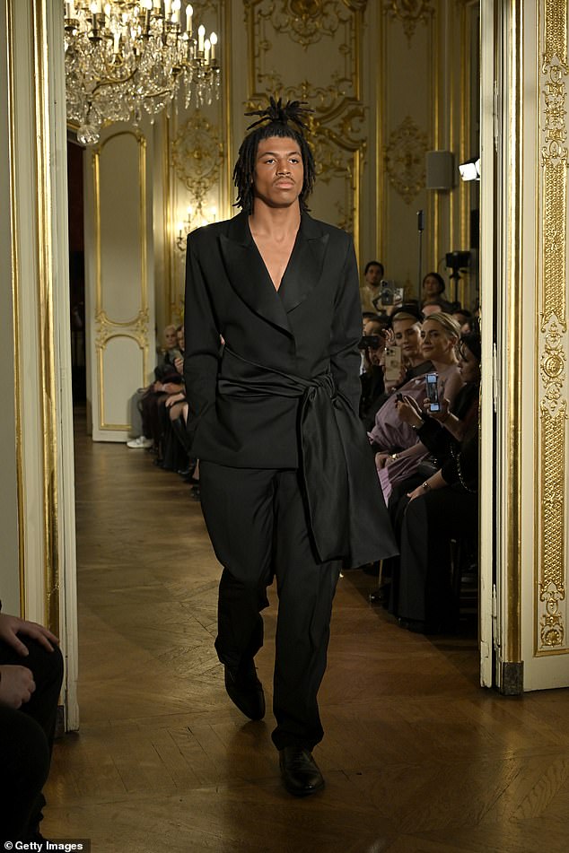 It's Henry Günther Ademola Dashtu Samuel, son of Heidi Klum and Seal! The 19-year-old made his runway debut on Tuesday as he walked at the Lena Erziak Haute Couture Spring-Summer 2025 show at Hotel le Marois, for Paris Fashion Week in France