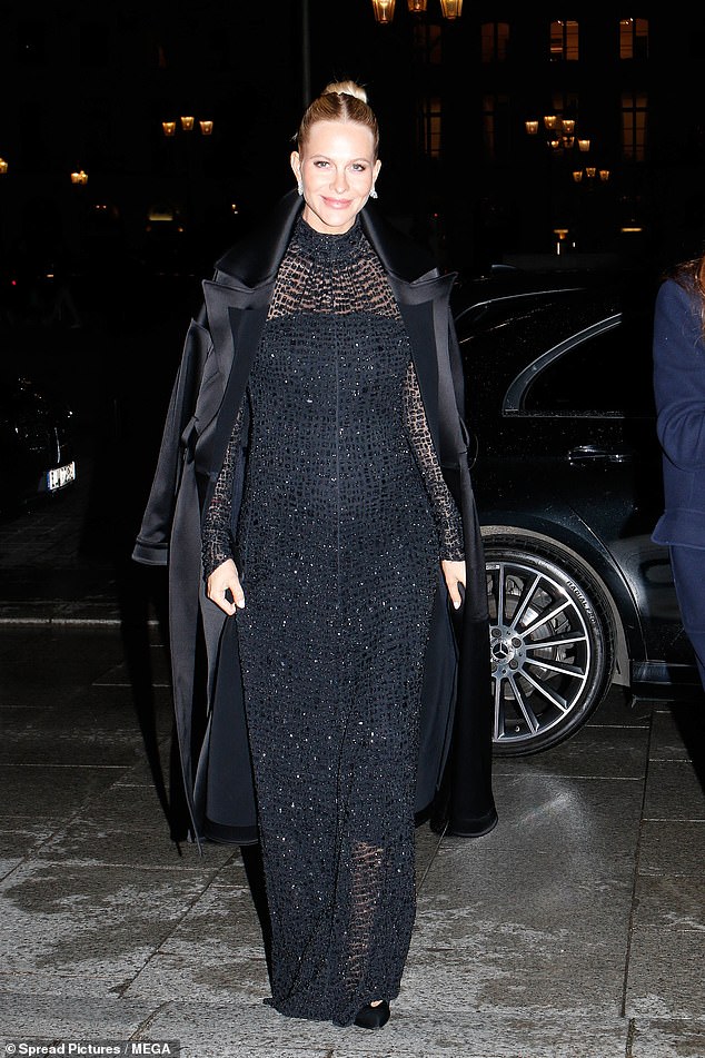 Poppy wowed in a glittering sheer gown, which accentuated her bump. She added a black satin coat over her shoulders and accessorised with dazzling earrings and heels