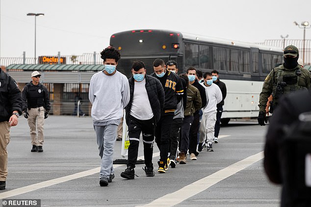 Migrants are escorted across the Hidalgo International border Bridge as they being deported under Title 8, a law that allows for immediate deportation after crossing into the U.S. without authorization, in McAllen, Texas, US, January 27, 2025