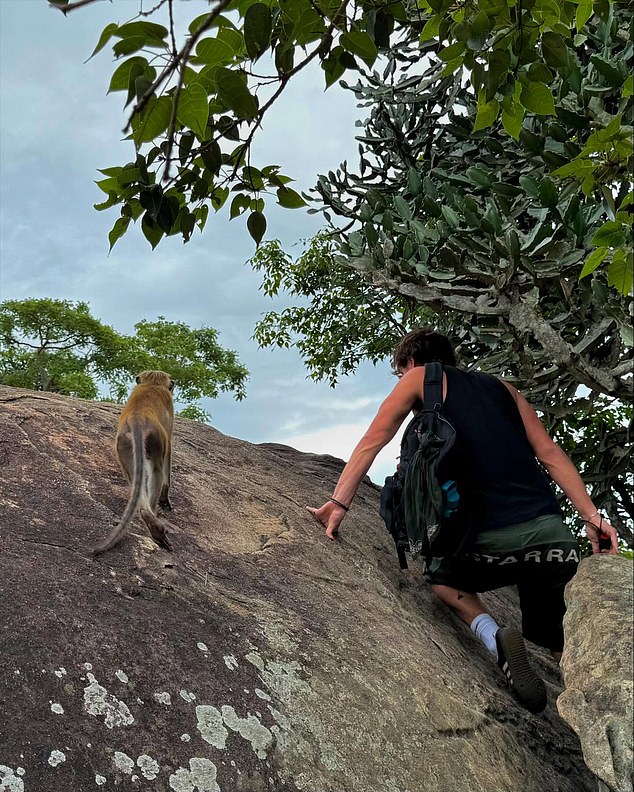 In another snap from their Sri Lanka trip, Mia showed Henry climbing up a rock accompanied by a monkey