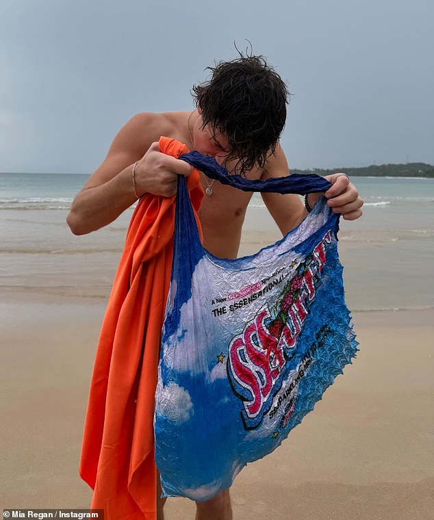 Among the snaps shared by Mia earlier this month, Henry was seen drying himself off after a dip in the sea