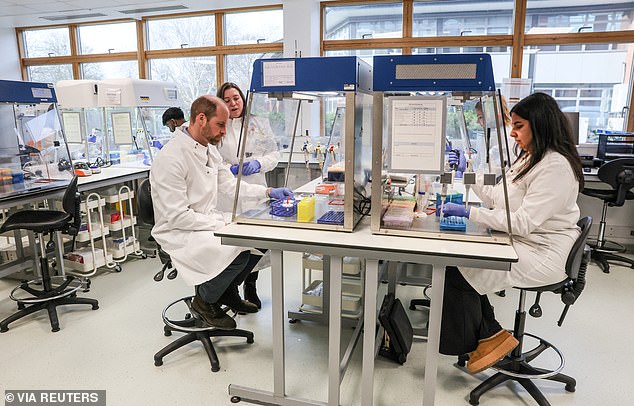 The Prince of Wales pictured making a mini extraction of DNA while sitting at a work bench today