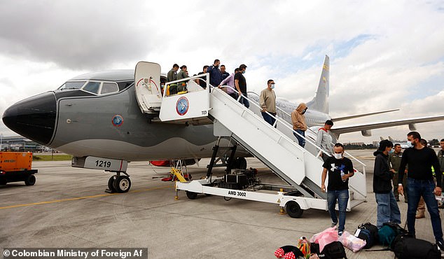 Migrants descending from a Colombian Air Force plane after being deported from the US in Bogota, Colombia on January 28, 2025