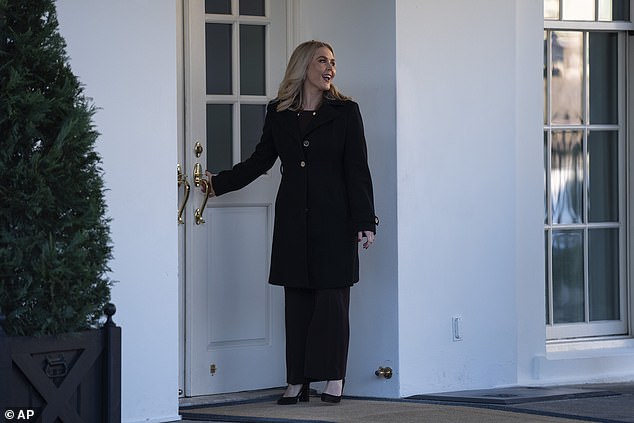 White House press secretary Karoline Leavitt walks into the White House after speaking with reporters.