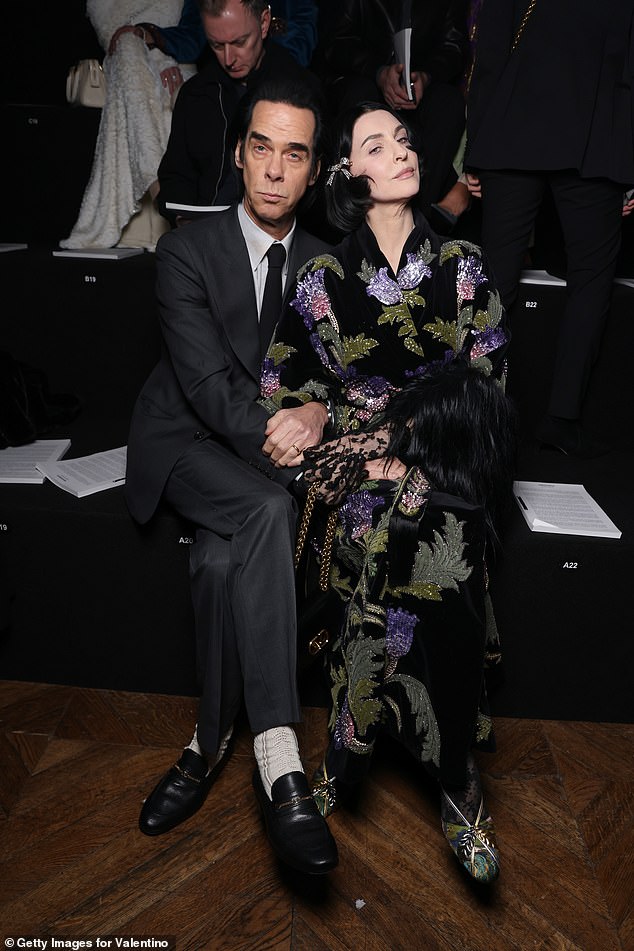 Nick Cave and his wife Susie also posed up a storm together as the musician looked rather dapper in a black suit, tie and white shirt