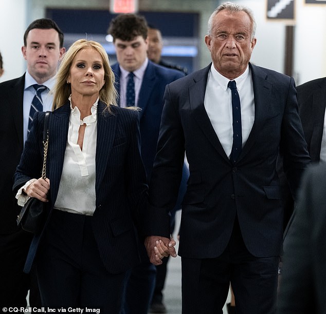 Caroline was a woman hailed by the media as the Kennedy family intellectual, until she started giving interviews littered with 'likes' and 'you knows'. (RFK Jr and his wife Cheryl Hines are pictured at his hearing Wednesday).