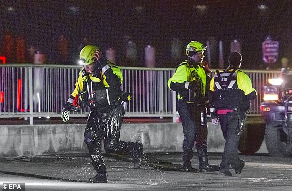 epa11862687 Rescue teams stage to help search the Potomac River after a commercial airplane reportedly collided with a military helicopter on approach to Ronald Reagan National Airport in Washington, DC, USA, 29 January 2025. According to a preliminary statement from the United States Federal Aviation Administration (FAA), a PSA Airlines Bombardier CRJ700 regional jet that departed earlier today from Wichita, Kansas collided in midair with a Sikorsky H-60 helicopter while on approach to Reagan Washington National Airport.  EPA/SHAWN THEW