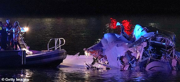 ARLINGTON, VIRGINIA - JANUARY 30: (EDITORS NOTE: Image contains graphic content) Emergency units respond after a passenger aircraft collided with a helicopter in the Potomac River near Ronald Reagan Washington Airport on January 30, 2025 in Arlington, Virginia. An American Airlines flight from Wichita, Kansas collided with an Army helicopter while approaching Ronald Reagan National Airport. (Photo by Andrew Harnik/Getty Images)