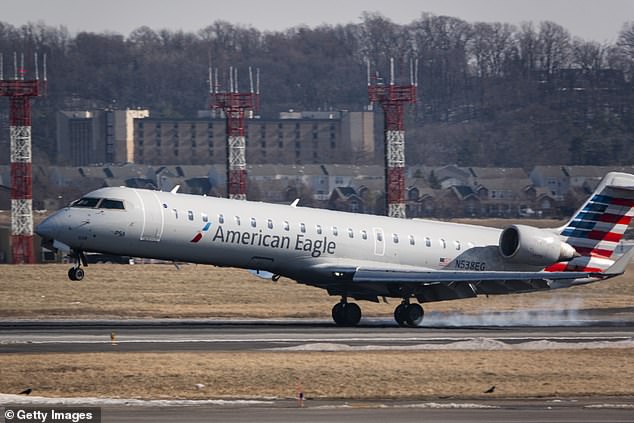 An American Eagle, operated by PSA Airlines, a CRJ-700 aircraft arrives at Ronald Reagan Washington National Airport on January 22, 2025 in Arlington