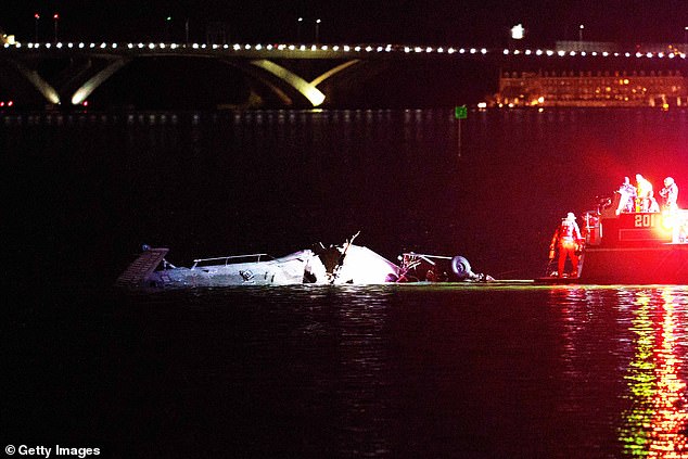 Emergency response teams are seen at the scene of the crash in the Potomac River