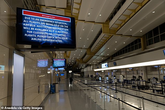 Signage displays an emergency message inside Ronald Reagan National Airport following a collision between an American Eagle flight and an Army helicopter in Washington