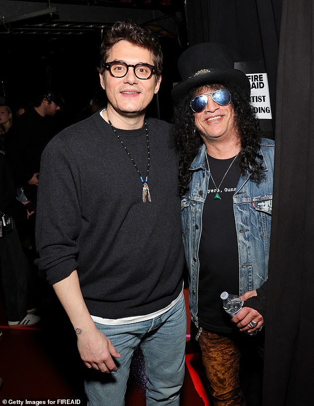 John posed with Slash