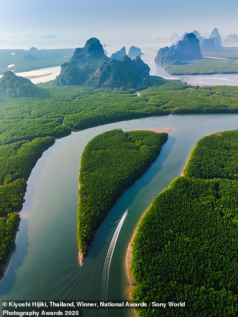 The winner of the Thailand national award, this stunning aerial photo of a boat cruising into Thailand's Phang Nga Bay was captured by Kiyoshi Hijiki