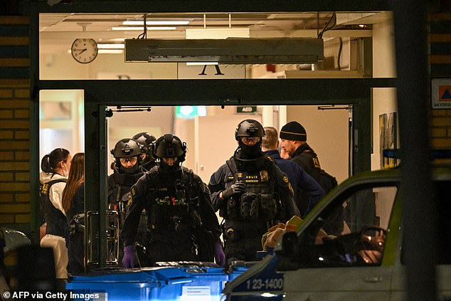 Police officers work at the scene of the Risbergska School in Orebro, Sweden