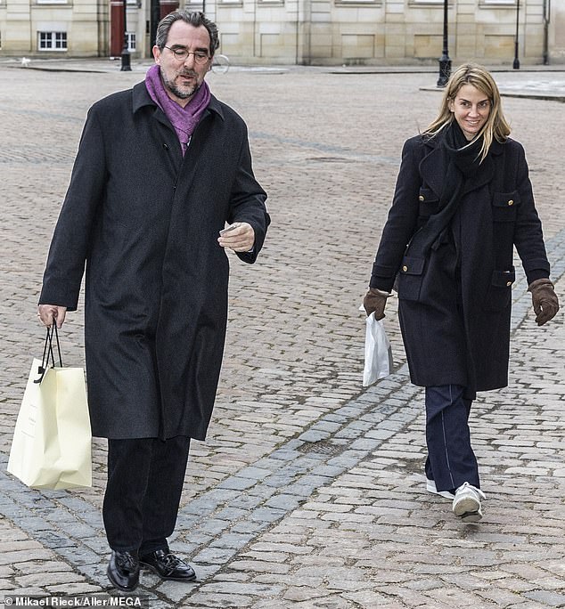 Pictured: Prince Nikolaos of Greece and his wife-to-be Chrysi Vardinogianni attend a farewell reception for Communications Director Lene Balleby at Amalienborg Palace last month