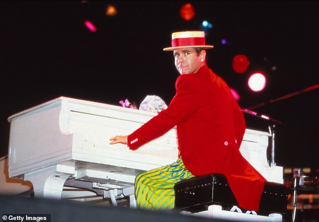 Sir Elton has been making hits for more than half a century (pictured onstage in 1984)