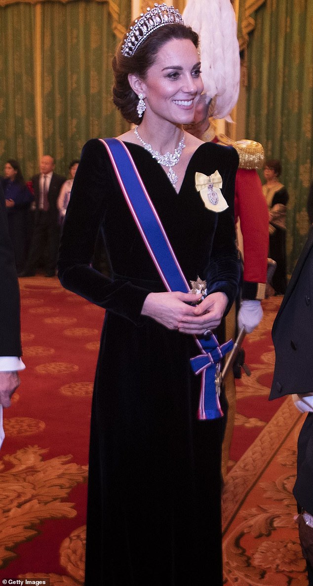 In what would prove to be her final appearance in a tiara at the annual Diplomatic Corps Reception held at Buckingham Palace in 2019 (pictured), she displayed a never-before-seen emerald and diamond necklace.