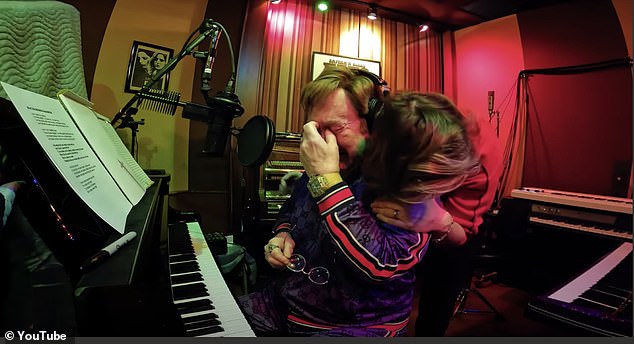 Sir Elton John is filmed breaking down while recording his new album, Who Believes In Angels?