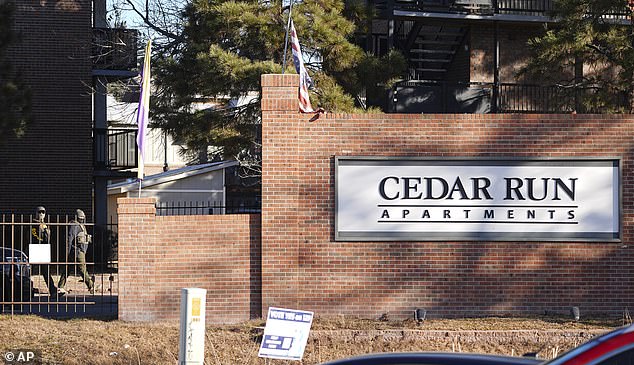 Law officials enter the Cedar Run apartments during a raid Wednesday, Feb. 5, 2025, in east Denver