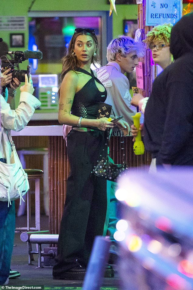 The stunning 25-year-old social media star, who spoke exclusively with DailyMail about her dating life at the Golden Globes , was seen hitting up the bars on Bourbon Street