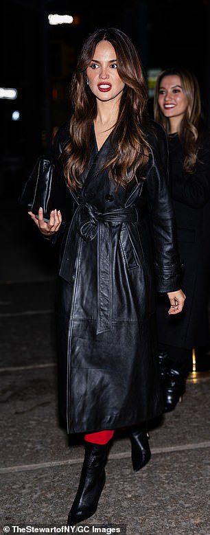 The Mexican 35-year-old arrived to the Hourglass Cosmetics bash in a black leather trench coat, matching booties, and clutch