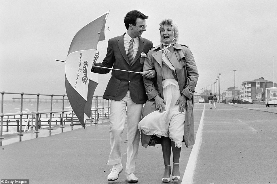 The winner of the Bognor 'Glamorous Grandmother' competition is photographed with a Butlin's Redcoat entertainer in 1985