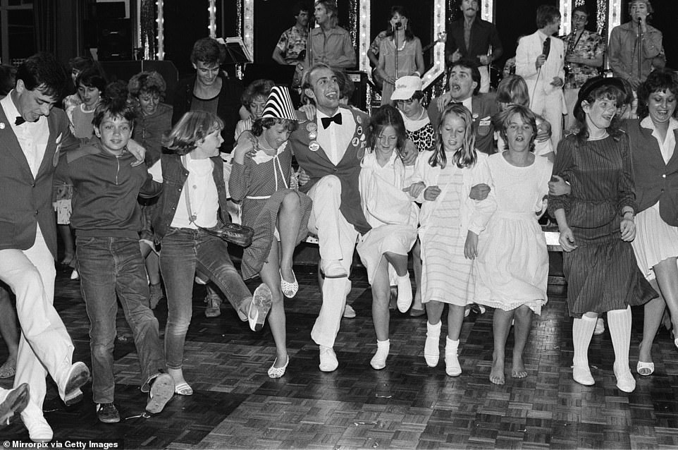 Butlin's opened in Bognor Regis in 1958. LoveBognorRegis reveals: 'The business was a runaway success, hosting in the region of 3,000 campers every week and easily justifying the then enormous build cost of around £2.5million/$3.1million.' The above image of dancing revellers was taken at the holiday camp in 1984