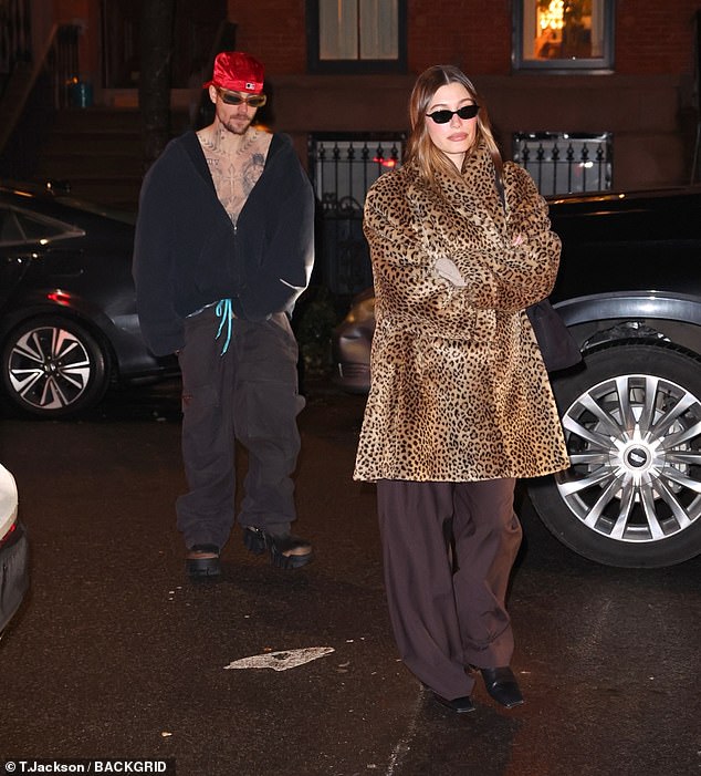 She paired her outfit with square-toed black leather boots with modest heels