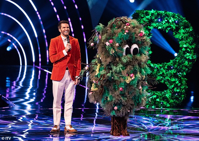 After some strong guesses, the judges were left stunned as Bush was revealed to be a soap icon[Bush pictured with host Joel Dommett]