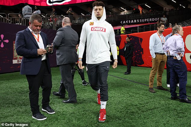 Mahomes quickly ditched his suit and headed out onto the field for his team's warmup