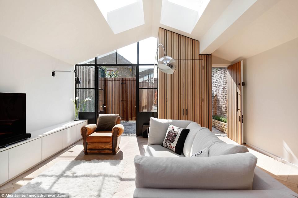 Housed on the site of a former wood yard between rear terraced gardens and a row of 16 West London garages, the existing storage shed was originally bought to prevent it from becoming overdeveloped.