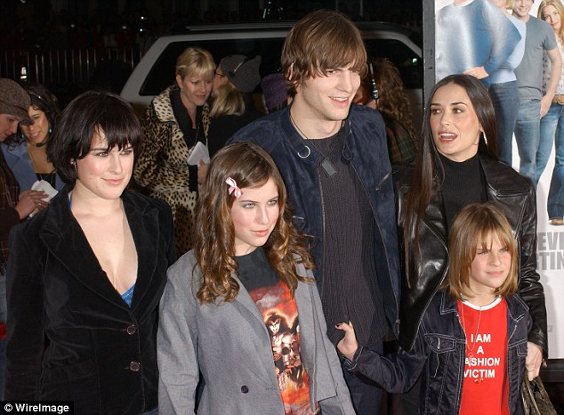 Family portrait: Demi is shown with daughters Rumer, Scout and Tallulah who clutched Ashton's sweater in 2003 at a premiere in Los Angeles