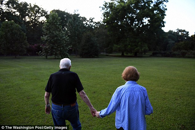 Carter walks with his wife, former First Lady, Rosalynn Carter towards their home following dinner at a friend's home on Saturday August 04, 2018 in Plains, GA