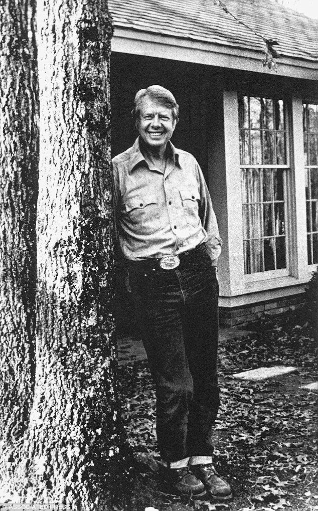 In this February 8, 1976, photo Carter is seen relaxing in blue jeans outside his home in Plains, Georgia, the town where he met his soulmate Rosalynn