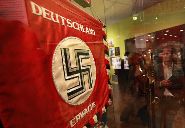 'Germany awake!': This Nazi flag is one of the displays at the Hitler And The Germans exhibition in Berlin