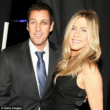 Eye eye: Adam Sandler sported a black eye at The People's Choice award and as he accepted his award from Jennifer Aniston was quick to make a joke about his injury