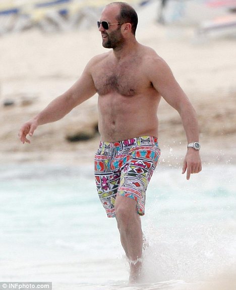 Fuller figure? Jason Statham looked bloated as he took a dip in the water