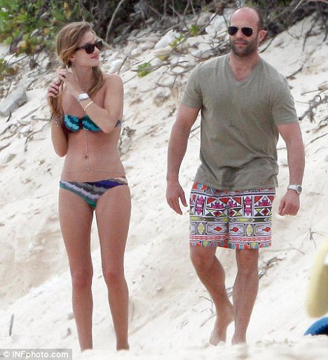 Beach bodies: Rosie and a chunkier-looking Jason spent time in the water and lapped up the sunshine on the sands