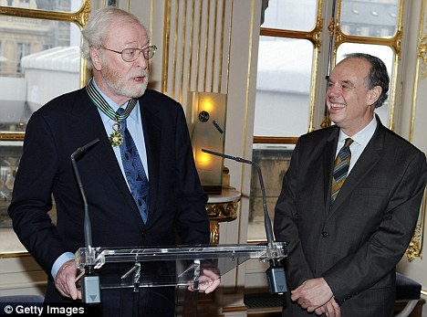 Faux pas: The legendary actor, here with French culture minister Frederic Mitterand, thought he was accepting a different award