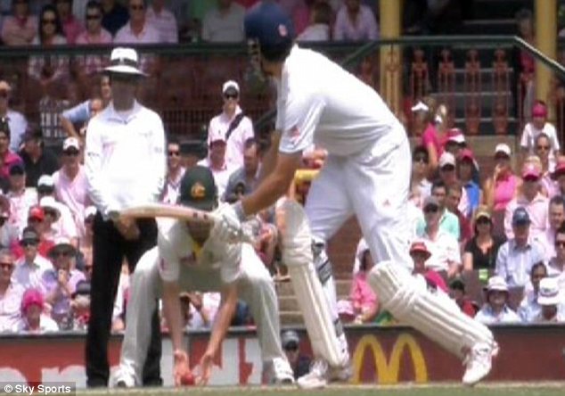 Controversy: Alastair Cook's shot clearly touches the ground before Phil Hughes takes the ball at short leg