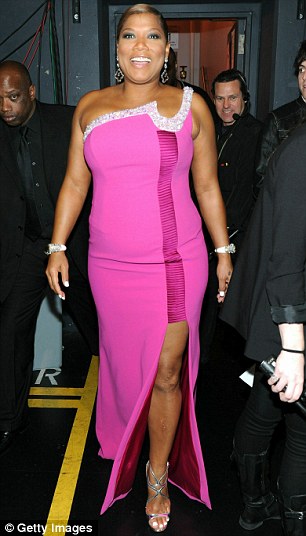 Colourful: The star made many outfit changes throughout the ceremony, seen here in a pink number and a tie-dyed blue and white gown