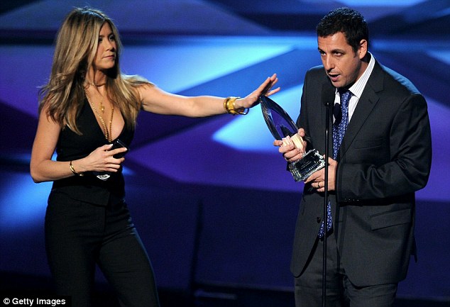 Here you go: Sandler was sporting a black eye as he appeared on stage to accept his trophy