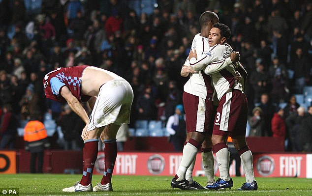 Piling on the misery: Kieran Richardson and Titus Bramble celebrates Sunderland's win