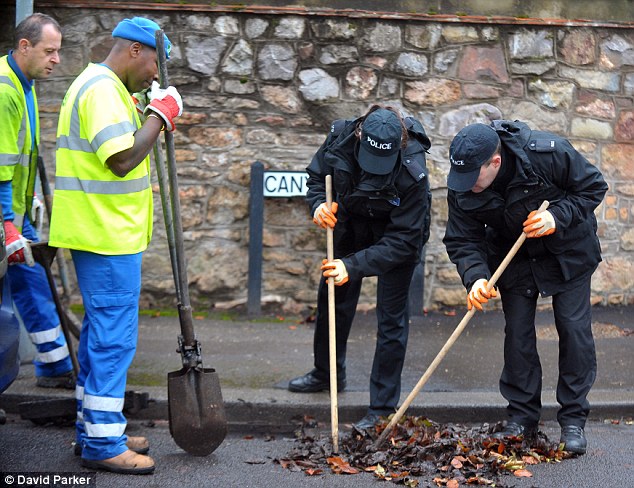 Search: Police were scouring drains in the streets surrounding Joanna Yeates' flat in Clifton. Around 40 were being checked for clues that might help in the investigation