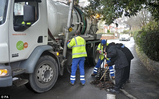 Probe: The drains were pumped with an industrial cleaner to dredge up debris before police worked through leaves and muds with sticks for murder clues