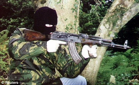 Lethal weapon: An AK-47 semi-automatic assault rifle is thought to have been used in the attack. The one above is being used by a Provisional IRA terrorist during the 1990s